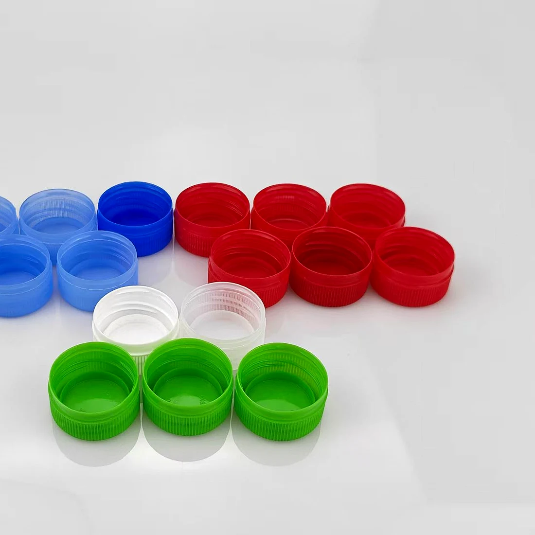 Bottle caps moulded in blue, red, green and white