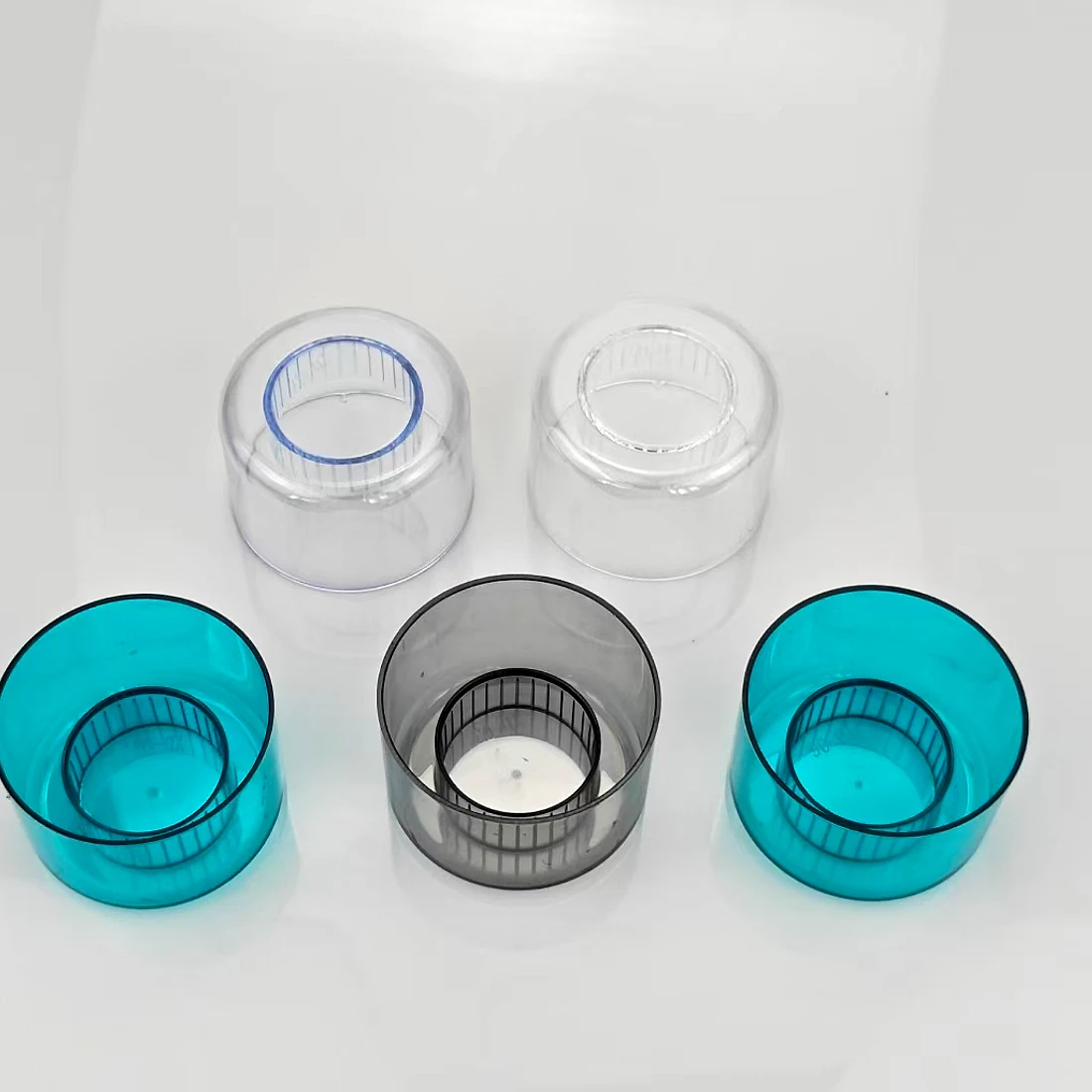 Clear and tinted decorative over-caps for mineral water bottles