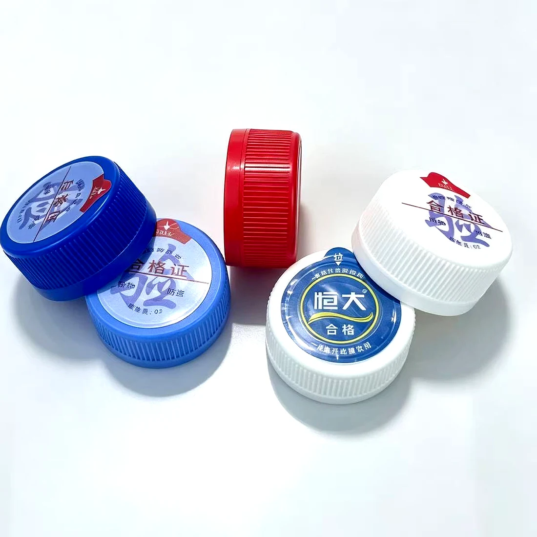Bottle caps with multi-colour printing on the top face