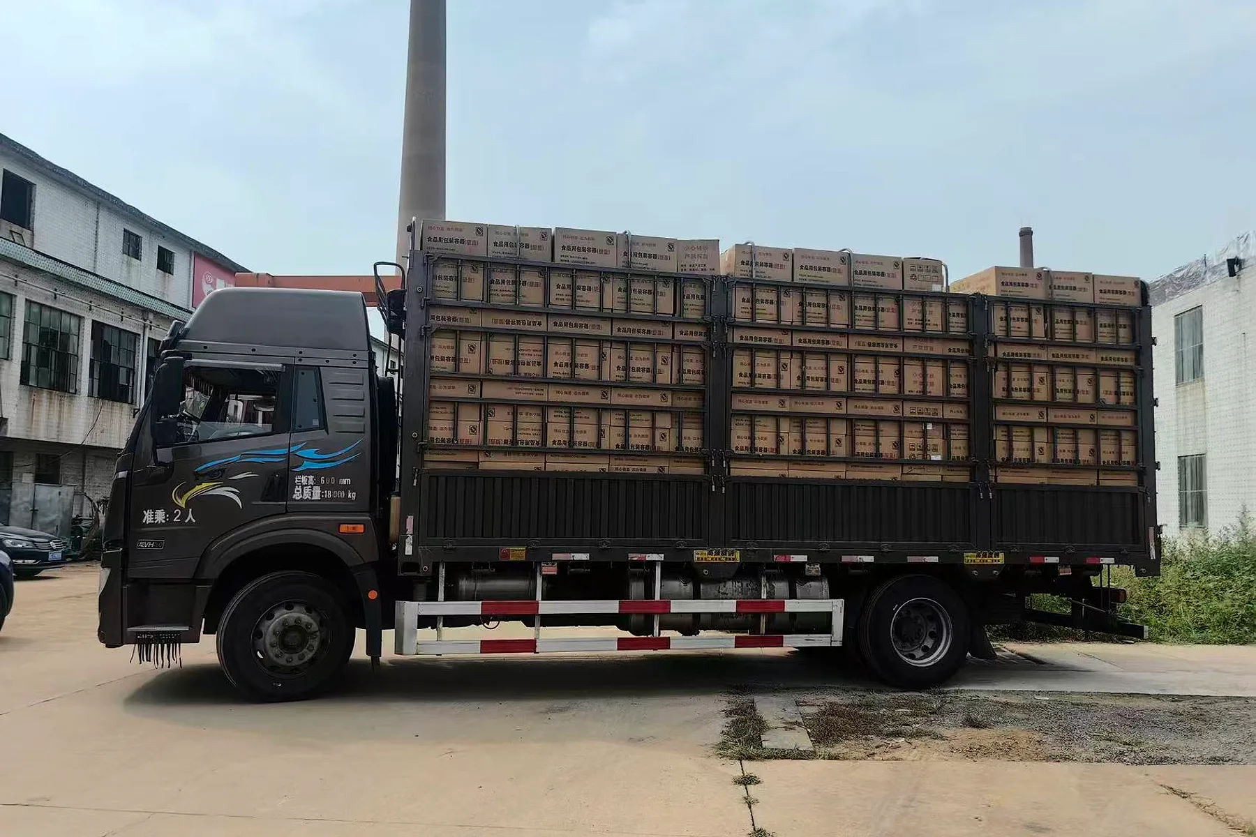 Truck loaded with export cartons in the factory yard